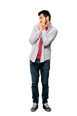 Fototapeta premium Full-length shot of Handsome man with beard nervous and scared putting hands to mouth over isolated white background