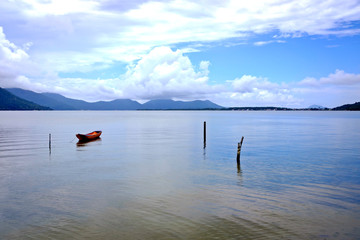Boat anchored in front of the sea