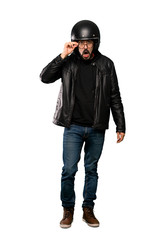 Full-length shot of Biker man with glasses and surprised over isolated white background