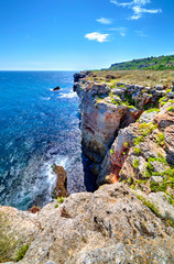 Stunningly beautiful landscape with rocky shore and blue sea