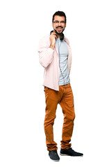 Handsome man with beard listening music