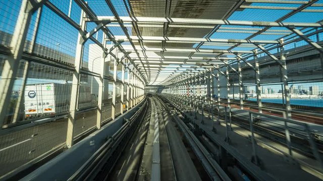 Time lapse of automatic train moving to tunnel in Tokyo, Japan. 4K