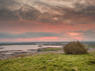 Sun rise over Galway bay, View from Burren national park, Dramatic sky, Atlantic ocean.