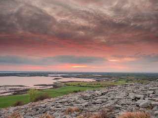 Sun rise, Burren national park, Ireland, Stone surface, Galway bay.