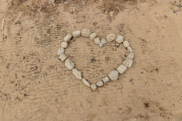 Heart in stones on beach