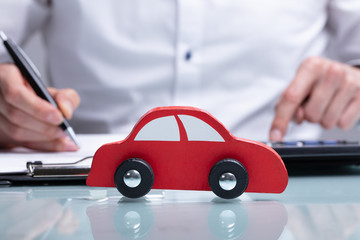 Businessman Calculating Car Loan
