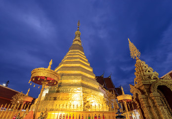 Fototapeta premium Golden pagoda for year of tiger at Wat Prathat Cho Hae Temple in Phrae province, north of Thailand