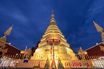 Fototapeta premium Golden pagoda for year of tiger at Wat Prathat Cho Hae Temple in Phrae province, north of Thailand