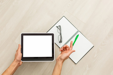 Digital tablet computer with isolated screen in male hands background