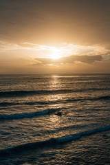 Waves in the Pacific Ocean at sunset, at Pearl Street Beach in Laguna Beach, Orange County, California