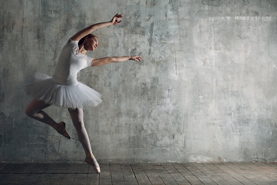 Fototapeta Young beautiful woman ballet dancer, ballerina in white.