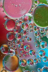 colored oil drops on water