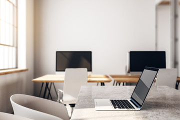 Desktop with laptop in boarding room