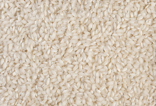 arborio risotto short grain rice texture background. nutrition. bio. natural food ingredient.