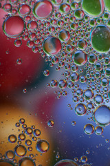 colored oil drops on water
