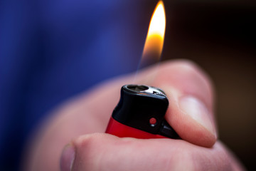 cigarette lighter in hand