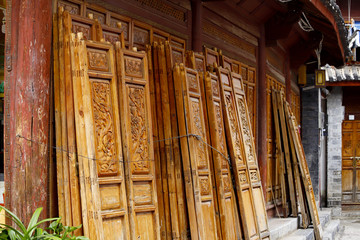 Wood carvings. Ancient carved wooden doors in the ancient city of Lijiang, Yunnan, China