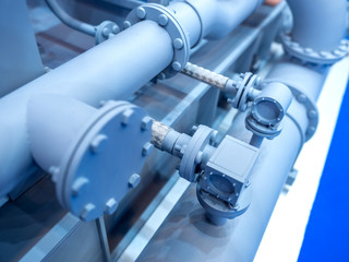 Industrial concept with pipes. Fragment of production. Gray pipes.