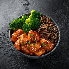 Teriyaki chicken, steamed broccoli and wild rice served in bowl