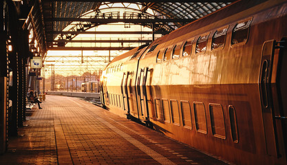 train stop at railway station with sunset