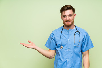 Surgeon doctor man holding copyspace imaginary on the palm