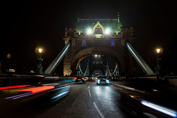 Fototapeta na wymiar Nightly traffic on Tower bridge.