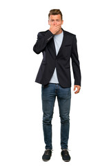 Blonde handsome man covering mouth with hands