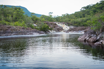 Amazonia river with a falls in the background. Yutaje, Venzuela