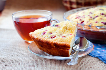 Piece of homemade cowberry pie on a pate