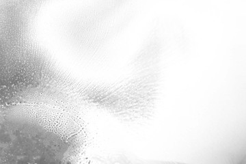 Gray alcohol ink texture with abstract washes and paint stains on the white paper background.