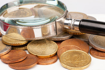 Pile of Euro coins isolated on white background. Selective focus