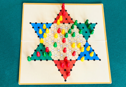 three-player gameboard of Diamond Game on table