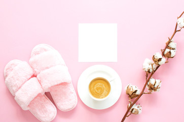 Composition of faux fur slippers and beverages on a light pink background. Healthy morning concept. Flat Lay. Top View