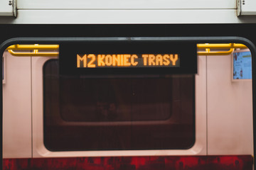 Close-up on part of the train. Display on the subway train with the sign of the end of the route....