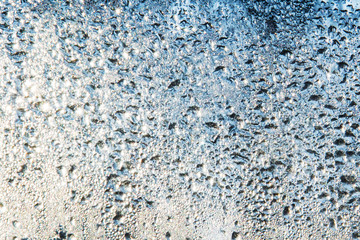 Water droplets on the glass, backlighting from different directions, large magnification, bokeh