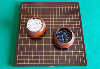 top view of playing stones for Go game in bowls