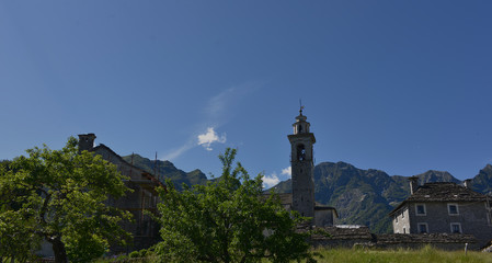 Fototapeta na wymiar Tower of the church raising above the village of campo rasa