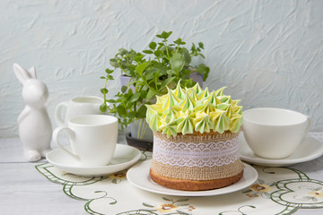 Spring Easter cake on the decorated table.