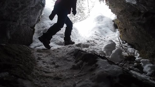 Woman backpacker in a winter hike snow forest trail national par Young girl enjoy snow falling . Happy winter holidays active lifestyle concept.