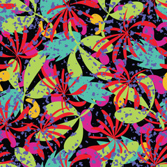 Seamless pattern with tropical leaves in vivid colors on a dark background