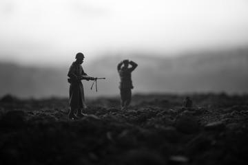 War Concept. Military silhouettes fighting scene on war fog sky background, World War Soldiers...