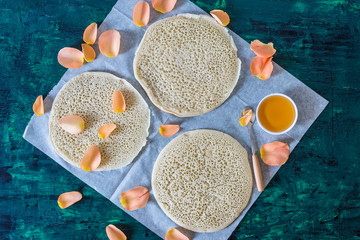 traditional Moroccan pancakes baghrir on dark green wooden background