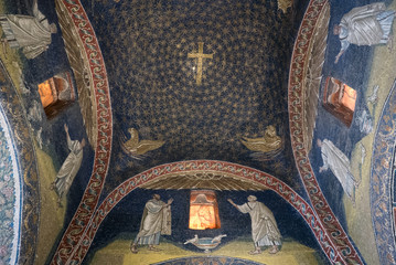 Interior of Mausoleum of Galla Placidia, a chapel embellished with colorful mosaics in Ravenna. It...