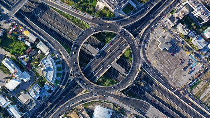 Aerial drone photo of multilevel highway junction urban ring crossing road during rush hour