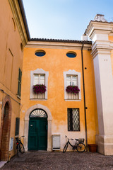 Nearby colorful house Chiesa dei Santi Giovanni e Paolo, in Ravenna