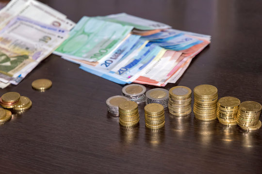 many banknotes and coins, lev and euro on the table ready for traveling