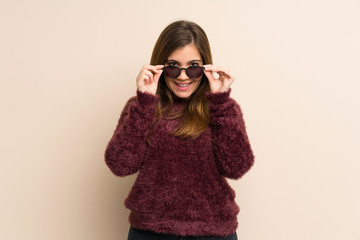 Young girl with glasses and surprised