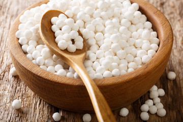 Organic tapioca pearls close-up in a bowl on a table. horizontal