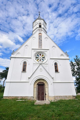 Fototapeta na wymiar white church of our Lady in village called Dragotin