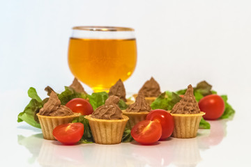 tartlets with liver pate decorated with lettuce and cherry tomatoes